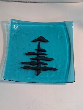 A handmade fused Aqua art Glass tray featuring an Black evergreen tree design.